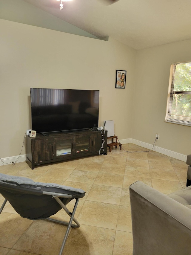 tiled living room with vaulted ceiling