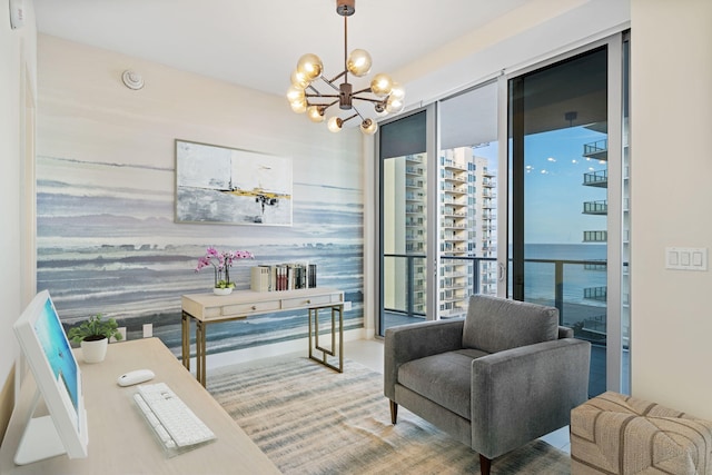 living area with a chandelier and a water view