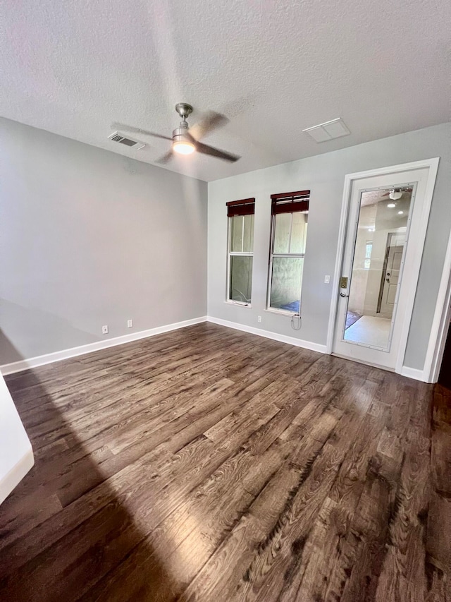 interior space featuring ceiling fan, a textured ceiling, and hardwood / wood-style floors