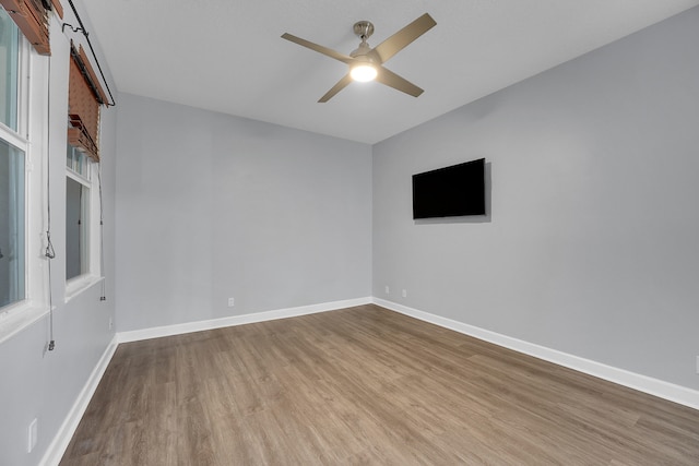 spare room featuring ceiling fan and wood-type flooring