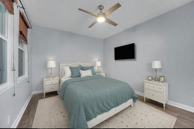 bedroom with ceiling fan and wood-type flooring