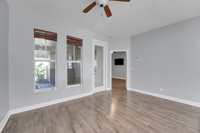 unfurnished room featuring ceiling fan and wood-type flooring