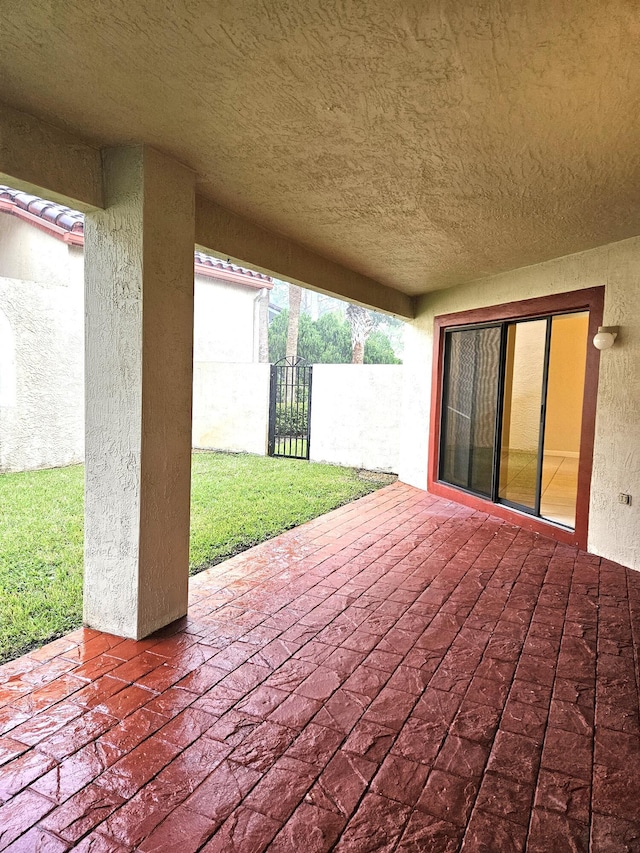 view of patio featuring fence