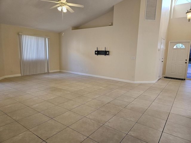 unfurnished room with ceiling fan, high vaulted ceiling, visible vents, and baseboards