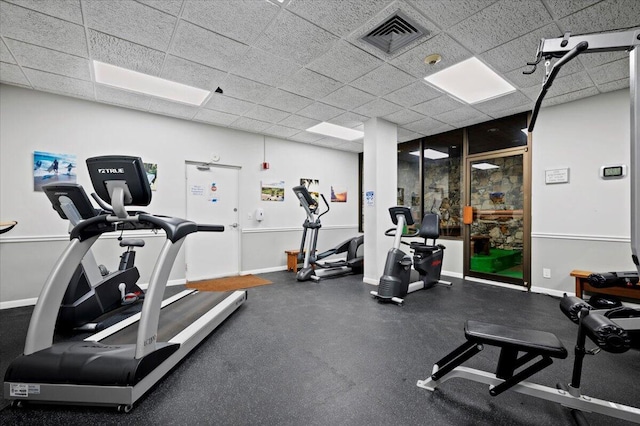 workout area featuring a drop ceiling