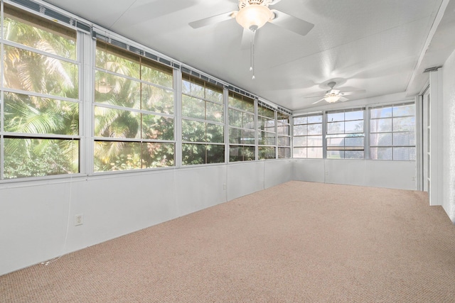 unfurnished sunroom with ceiling fan