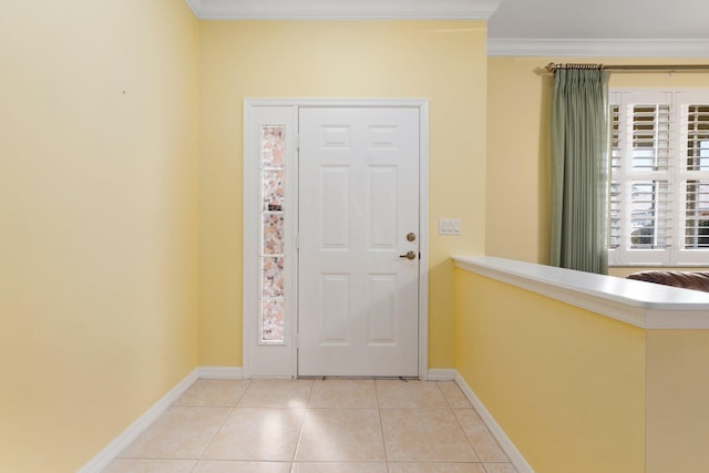 entrance foyer featuring crown molding and light tile patterned floors