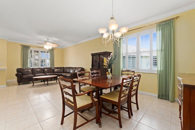 tiled dining space with crown molding, plenty of natural light, and ceiling fan with notable chandelier