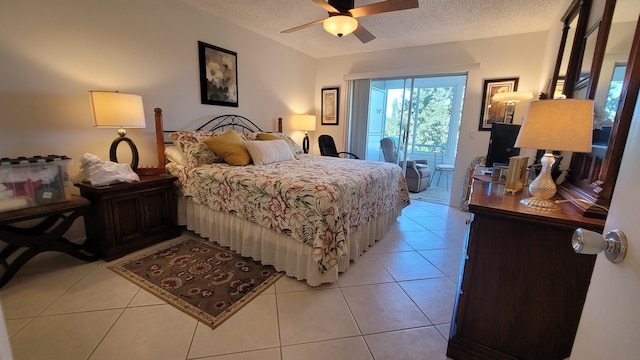 bedroom featuring light tile flooring, ceiling fan, and a textured ceiling