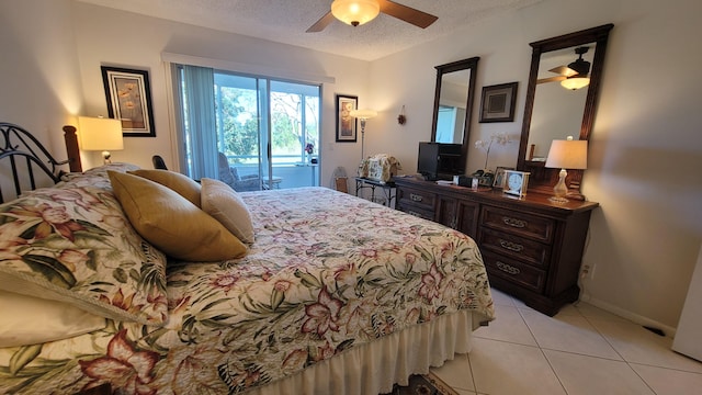 tiled bedroom featuring access to exterior, ceiling fan, and a textured ceiling