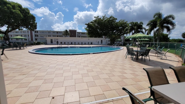 view of swimming pool featuring a patio