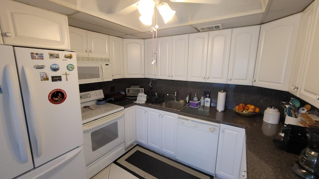 kitchen featuring ceiling fan, white appliances, white cabinets, backsplash, and sink