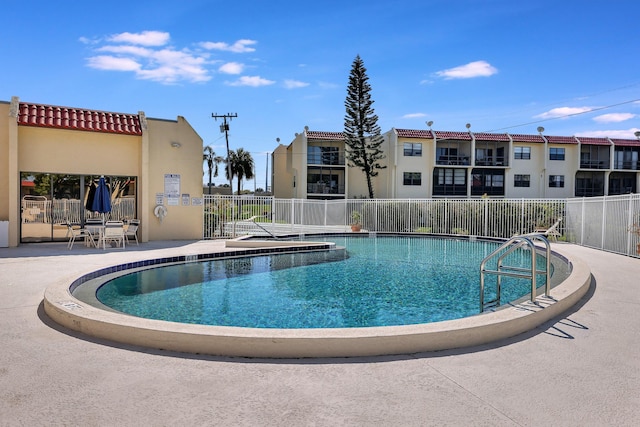 view of swimming pool with a patio area