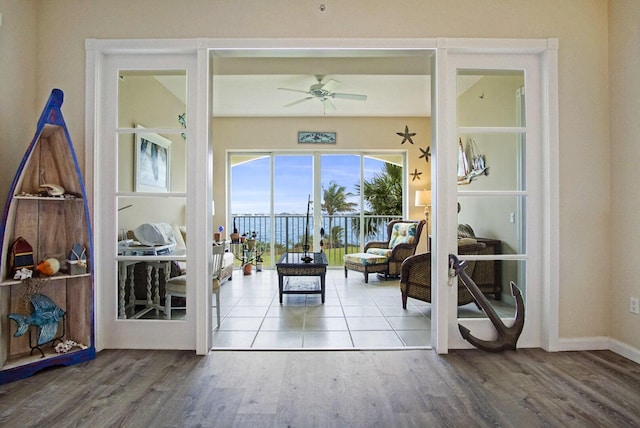 entryway with hardwood / wood-style flooring and ceiling fan