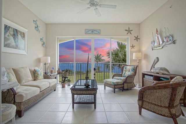 living room with ceiling fan and light tile patterned flooring