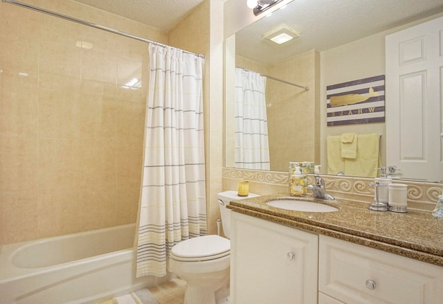 full bathroom featuring a textured ceiling, vanity, toilet, and shower / bath combination with curtain