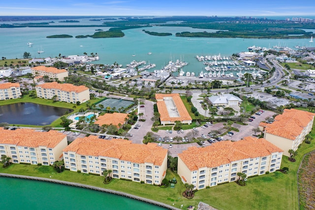 birds eye view of property with a water view