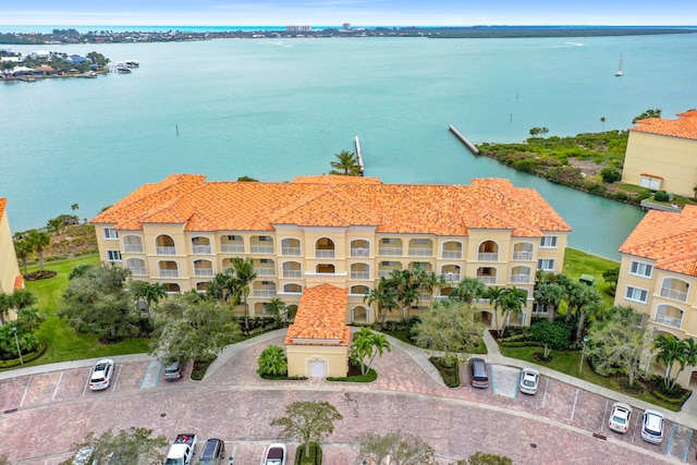 birds eye view of property with a water view