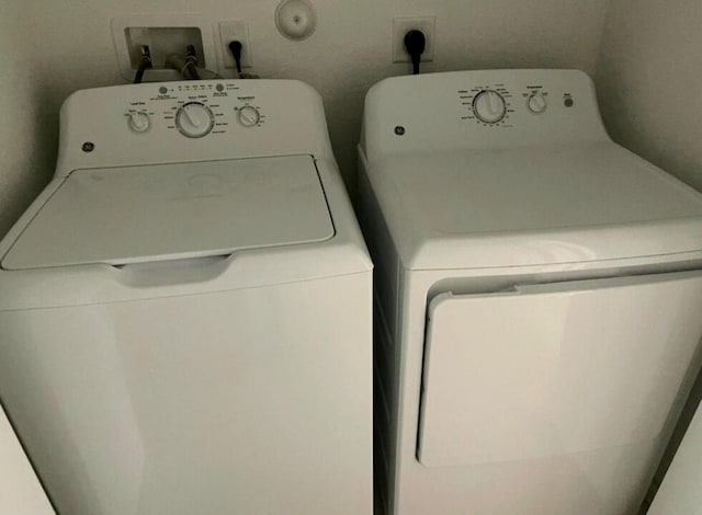 laundry area featuring washer and dryer, electric dryer hookup, and washer hookup