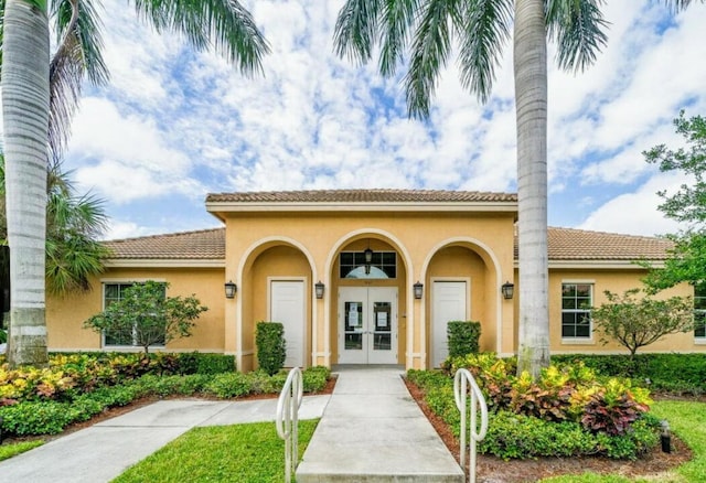 mediterranean / spanish home with french doors