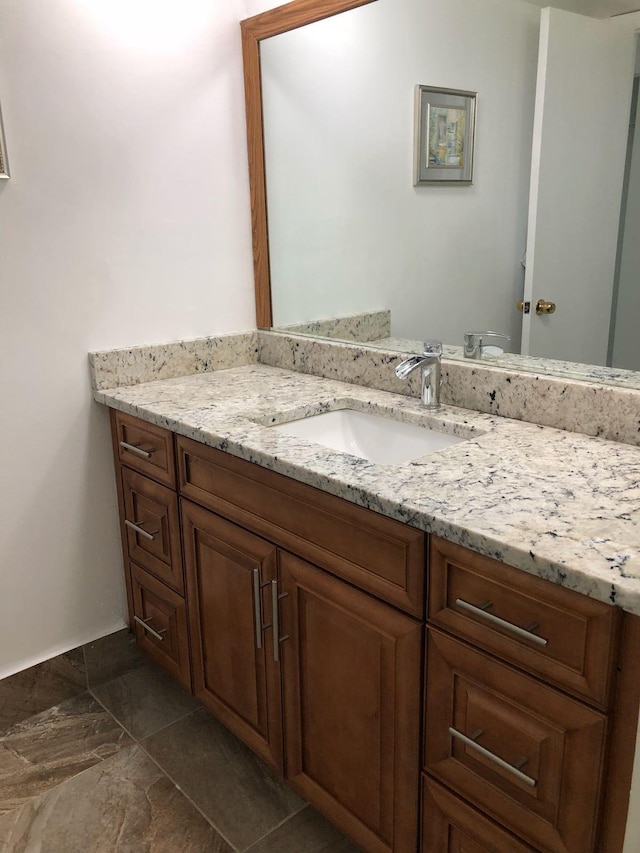 bathroom featuring vanity and tile floors