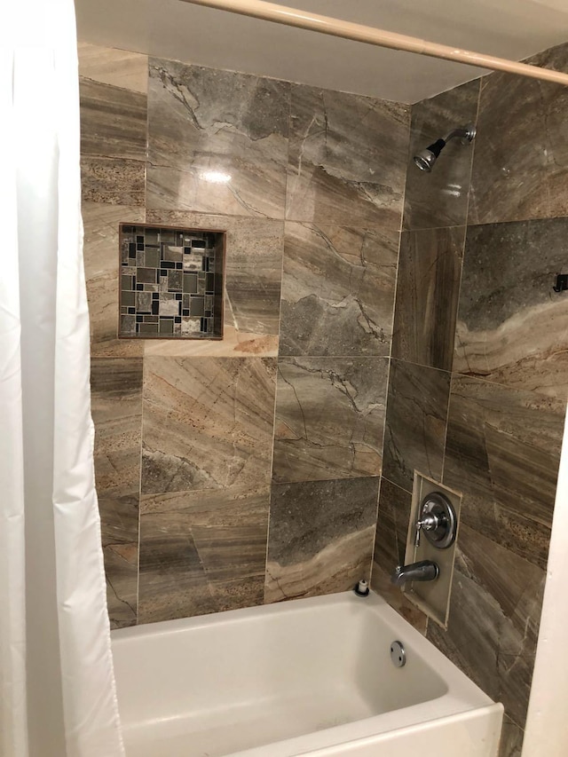 bathroom with shower / tub combo with curtain