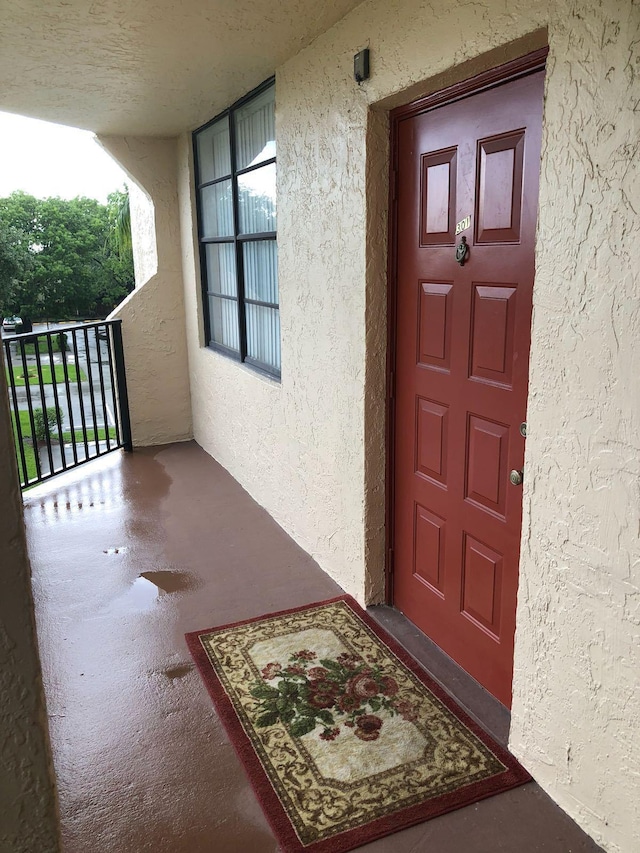 doorway to property featuring a balcony