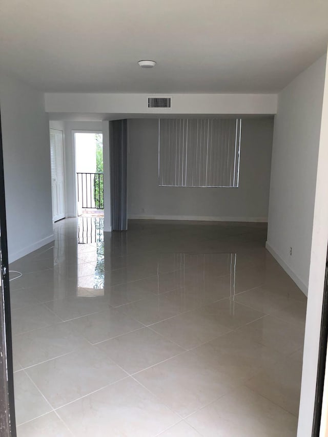 empty room with light tile floors