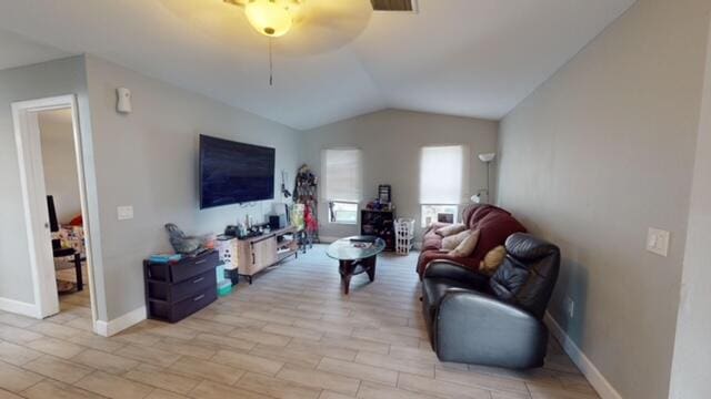 living room featuring lofted ceiling and ceiling fan