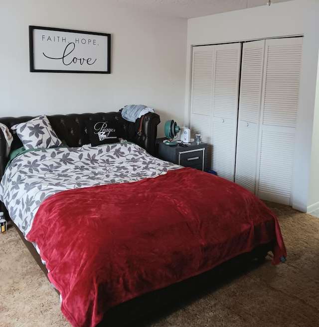 bedroom featuring a closet and carpet