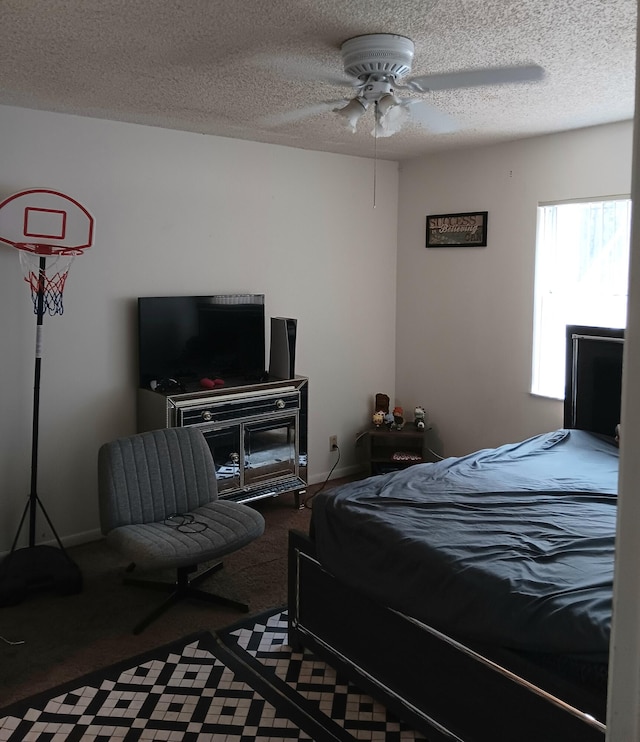 bedroom with a textured ceiling, ceiling fan, and carpet flooring