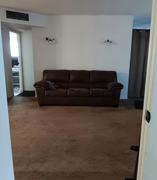 living room with dark carpet