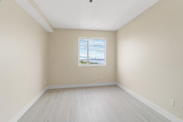 spare room with light wood-type flooring