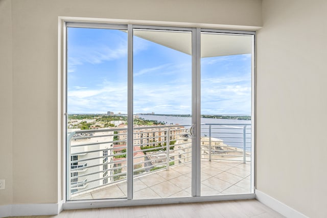 doorway to outside featuring light hardwood / wood-style flooring and a wealth of natural light