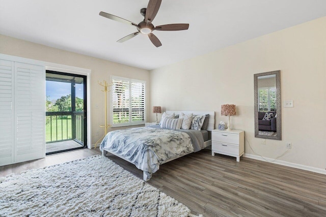 bedroom with ceiling fan, dark hardwood / wood-style floors, and access to exterior