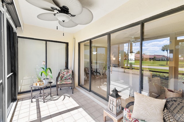 sunroom / solarium with ceiling fan