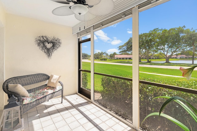 sunroom / solarium featuring ceiling fan