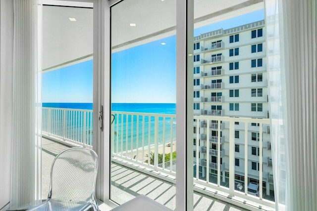 balcony featuring a water view