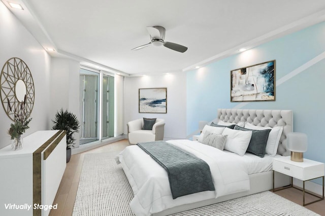 bedroom with access to exterior, light hardwood / wood-style flooring, and ceiling fan