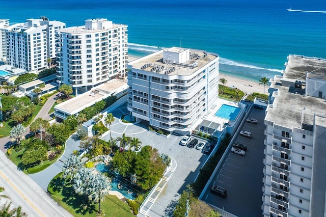 bird's eye view with a water view and a view of the beach