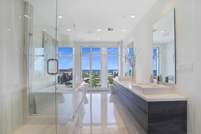 bathroom featuring vanity and an enclosed shower