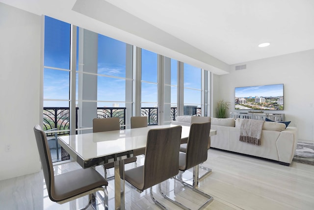 dining room with light hardwood / wood-style flooring