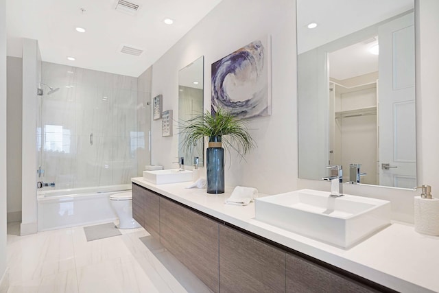 full bathroom with shower / bath combination with glass door, vanity, and toilet