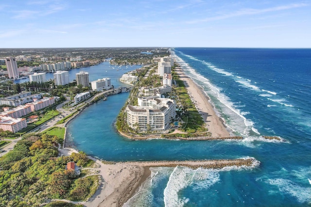 bird's eye view featuring a water view and a beach view