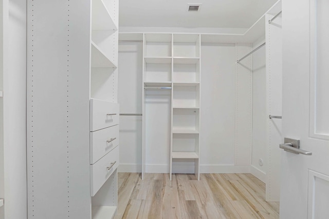 walk in closet featuring light hardwood / wood-style floors