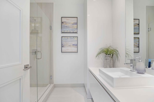 bathroom featuring walk in shower, tile patterned floors, and vanity