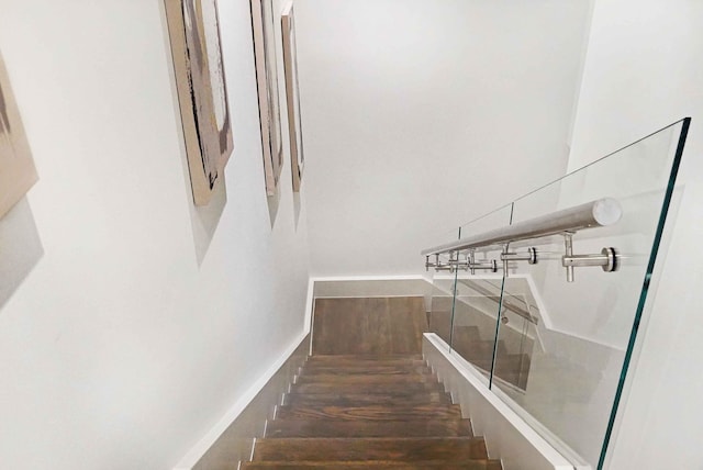 staircase featuring hardwood / wood-style flooring