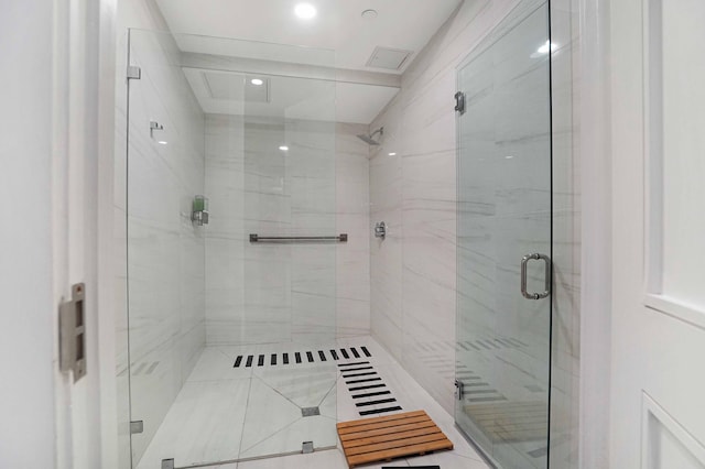 bathroom featuring tile patterned flooring and a shower with door