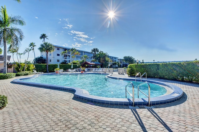 view of swimming pool with a patio area