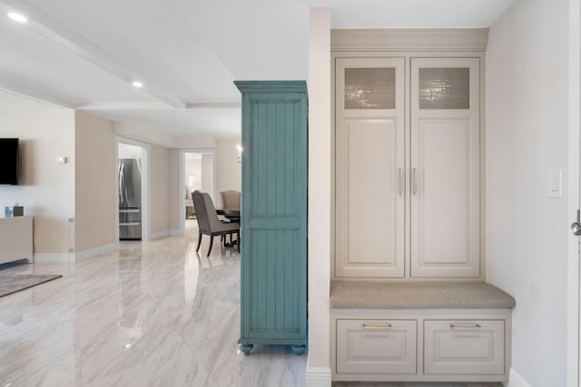 mudroom featuring light tile floors